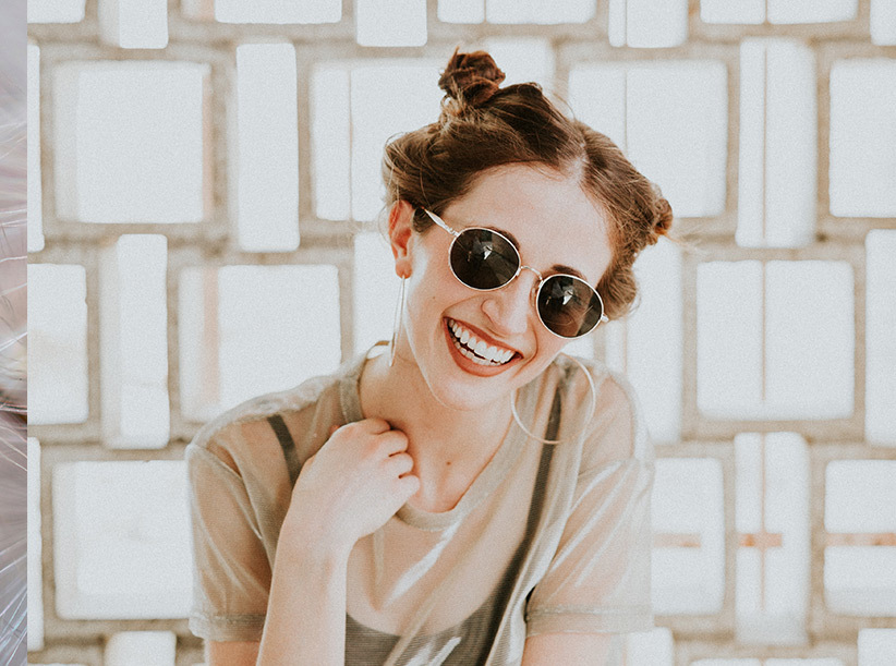 Portrait of a woman smiling wearing sunglasses